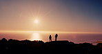 Couple, silhouette and hiking on mountain at sunset with ocean, sky and mockup space on vacation in summer. People, outdoor and together on hill with view, sea or horizon with trekking in New Zealand