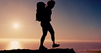 Woman, hiking and prosthetic leg on mountain, outdoor or summit for ocean view with sunshine. Silhouette, trekking and fitness for person with disability on adventure, tourism and sea with sunset sky