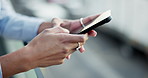Hands, mobile and business person in city for networking, scroll or social media closeup. Phone, typing email and professional finance agent on internet for communication, info and news notification