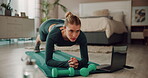 Fitness, woman and laptop in home for exercise, resistance training or core strength. Girl, computer or planking in bedroom with tutorial, streaming music or yoga on mat with concentration in pilates