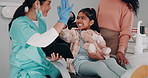 Girl, women and dentist with tablet for high five, xray demonstration and results of tooth cleaning procedure. Child, mother and orthodontist for interactive learning, health advice and dental clinic