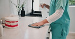 Dentist, hands and wipe office with disinfectant for bacteria, germs or hygiene with cloth in clinic. Healthcare, professional or person cleaning hospital surface with spray for safety or maintenance