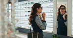 Woman, optometry and choosing glasses for eye care, medical professional or consultation at optometrist. Female person, spectacles and mirror in clinic or ophthalmology center for size, frame or lens