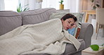 Tired, sick and woman on sofa with tissue paper, blanket and exhausted with allergies, flu or cold in home. Breakup, depression and sad person on couch with fatigue, illness or mental health burnout.