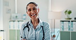 Doctor, woman and arms crossed for healthcare in office with medical confidence, health insurance and treatment. Laughing, mature employee and portrait in clinic for cardiology, wellness and service