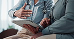 Doctor, hands and consulting patient with tablet for diagnosis, medical results or advice at hospital. Closeup, women and healthcare discussion with technology for health procedure or clinic process