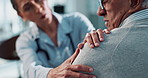 Woman, doctor and patient with shoulder pain for consultation, elderly care or exam at hospital. Female person, medical employee or health consultant helping senior client with injury, pain or ache