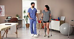 Physical therapy, crutches and woman with prosthetic leg for walking, rehabilitation or help. Amputee patient, nurse or person with disability in clinic for medical, healthcare or talking for support