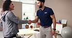 Walking frame, woman or shaking hands with physiotherapist for welcome, meeting or help. Greeting, physical therapy or handshake with person with disability in rehabilitation for healthcare in clinic