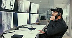 Security guard, safety and microphone with man in control room for surveillance management, evacuation protocol and monitor system. Inspection, technology and computer screen with person in office