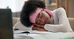 Sleeping, black woman or student in home with burnout, fatigue or books for studying on laptop. College, overworked writer or tired girl resting at desk with notes, diary or paper journalism project