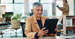 Woman, tablet and typing in office for business, email and company web update. Mature assistant, tech and happy in corporate workplace with schedule, economy research or smile for industry growth