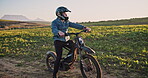 Ebike, cycling and adventure with person in countryside for sustainability, travel and relax. Peace, environment and speed with ride on trail for challenge, carbon footprint and transportation