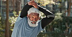 Stretching, outdoor and fitness of mature man, exercise and training in park, sportswear and serious. Nature, workout and benefits of longevity, healthy or routine for black person in morning