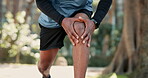 Man, knee and outdoor running with pain, fitness injury and muscle inflammation in nature. Male person, legs and massage joint for relief in park, sports accident and performance for strain on bone