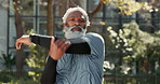 Stretching, active and fitness of mature man, exercise and training in park, sportswear and serious. Outdoor, workout and benefits of longevity, healthy or routine for black person in morning