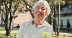 Face, fitness and senior woman at park with water for exercise, health and wellness. Portrait, smile and person with hydration bottle for natural liquid or drink for training and workout in Ireland