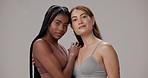 Underwear, hug and face of women in studio for wellness, natural beauty and body positivity. Happy, diversity and portrait of people in bra with confidence, self love and inclusion on gray background