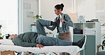 Woman, physiotherapist and stretching leg with senior for physical therapy, muscle exercise or recovery at clinic. Female person, therapist and elderly patient with knee injury, joint pain or ache