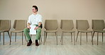 Waiting room, man and thinking with document for job interview, vacancy process and business hiring. Chairs, candidate and nervous with cv for creative agency, recruitment and designer opportunity