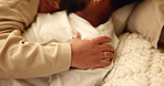 Couple, hands and resting with bonding on bed for connection, intimacy and massage shoulder in home. People, relax and comfort in bedroom with commitment, trust and loyal relationship in apartment