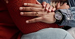 Care, holding hands and couple on sofa in home with support, comfort and empathy. Love, marriage and closeup of man and woman with connection for commitment, security or bonding together at house.