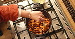 Pot, above and woman with food, hands and stir to mix ingredients, prepare lunch and recipe. Closeup, house or person in kitchen, utensils and dinner with healthy meal, nutrition or cooking with meat