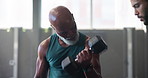 Mature man, dumbbells and weightlifting in gym for exercise, workout or training. Physical therapy, personal trainer and help with routine with fitness, equipment and wellness for retirement health