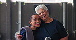 Happy, gym and face of senior women for fitness, workout or health training. Smile, hug and portrait of elderly female friends in sports center for wellness exercise, activity or mobility challenge.