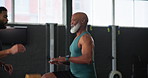 Senior man, coach and cardio exercise in gym with jumping, retirement wellness or endurance for healthy body. People, instructor or workout instruction for training, fitness and cardiovascular health