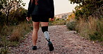 Back, fitness and prosthetic leg for hiking on mountain for exercise, workout and walking with path. Morning, training and person with a disability outdoor for adventure, hobby and rehabilitation