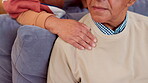 Hand, shoulder and support with senior couple on sofa in living room of retirement home for comfort. Empathy, love or wellness with old man and woman for grief, loss or pain in apartment together