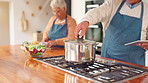 Tablet, cooking and old couple in kitchen with food, relationship and love in retirement together. Help, senior man and woman in home with bonding, support and digital app with meal prep for lunch