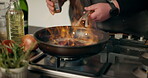 Food, flame and frying pan with hands of person in kitchen for cooking, fire and meal prep. Nutrition, cuisine and dinner with chef and flambe at home for wellness, dining and healthy ingredients