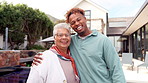 Hug, funny and face of family at house for love, bonding and happiness together. Relax, outdoor and portrait with senior mother and man embrace in home for care, generations and support in Brazil