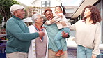 Love, care and outdoor with face of big family at home for happiness, generations and summer. Grandparents, funny and child with portrait of people at house together for smile, bonding and Brazil