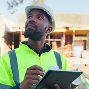 Black man, architect and tablet for inspection of construction planning ...