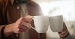 Morning, coffee and couple toast in home kitchen with conversation, cup and mug with drink. Relax, communication and love of people with cheers, house and marriage talking for breakfast plan with tea