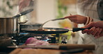Hands, cooking and shaking of pan, recipe and meal preparation for event and restaurant. Kitchen, chef and person with ingredients for culinary, seasoning and frying of food, catering and hotel