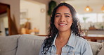 Woman, home and laughing or happy on sofa for fun to relax, break and chill in Brazil. Female person, housewife and smile or satisfied on portrait with confidence on couch in living room to rest