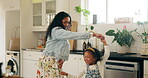 Mom, girl and happy with dancing in kitchen at home for bonding, fun and care. Parent, kid and smile or excited with music as family with playing or learning for child development, growth and support