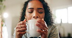 Woman, drinking coffee and home with satisfied, happy and enjoy for breakfast, beverage or morning. Female person, lounge and positive with mug, pride and comfort for weekend, relax or peace in house