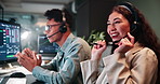 Woman, man and talk at night in call center, excited and feedback for trading, advice and info. Person, consultant or agent at help desk with voip, tech support or customer care at investment agency