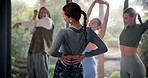 Woman, back and stretching with group for yoga with wellness, muscle and peace in studio with mindfulness, People, friends and warm up at club for pilates, health and solidarity in morning at class