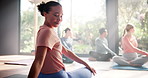 Yoga, stretching and woman on floor in class for fitness, natural exercise and morning balance together. Workout, pilates and people on mat for muscle warm up, body wellness and self care in studio