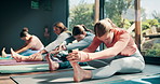 Yoga class, floor and people stretching legs for fitness, natural exercise and morning balance together. Workout, pilates and group on mat for muscle warm up, body wellness and self care in studio