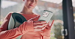 Woman, yoga and hands typing with phone for fitness, online browsing or health tips at home. Closeup, female person or yogi scrolling with mobile smartphone for research, social media or exercise app