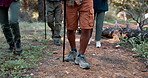Stick, legs or people in forest walking for outdoor adventure or journey for travel in nature or woods. Shoes, hiking path or friends on vacation holiday for exercise, trip or trekking to explore
