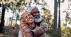 Hugging, love and senior black couple in nature on vacation, holiday or getaway together. Marriage, happy and elderly African man and woman embracing for bonding, care and commitment outdoor on trip.