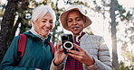 Mature women, hiking and phone in nature for social media, good news or comedy video on internet. Guide, senior person or mobile in forest for service review, website information or smile for support